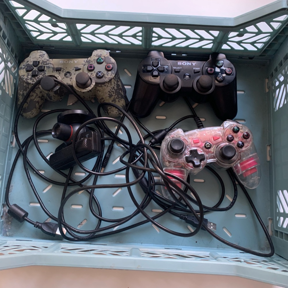Sony PS3 controllers, camera and games
